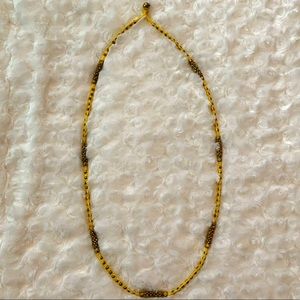 Noonday Collection yellow and gold necklace